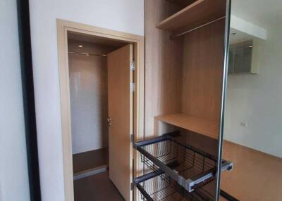 Closet with shelves and wire drawers