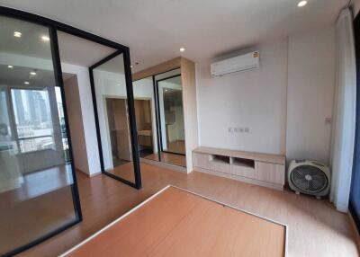 Modern bedroom with wooden floor and built-in storage