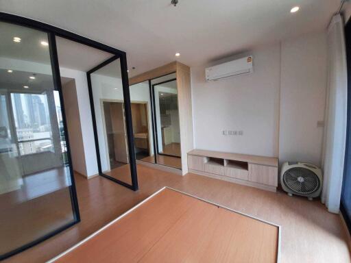 Modern bedroom with wooden floor and built-in storage