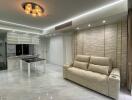 Modern living room with sofa, dining table, and ceiling lights