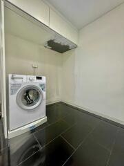 Laundry room with washing machine and cabinet space