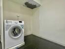 Laundry room with washing machine and cabinet space