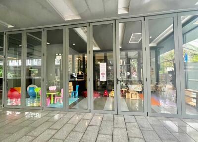 Glass doors opening to a space with children