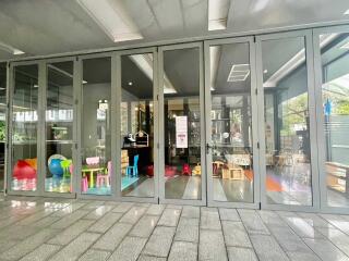 Glass doors opening to a space with children