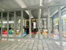 Glass doors opening to a space with children's play area