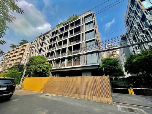 Modern apartment building exterior with greenery