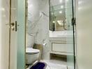 Modern bathroom with marble tiles and mirror