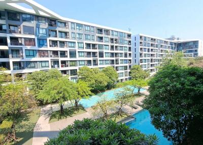 Apartment complex with swimming pool and garden area