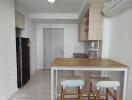 Modern kitchen with bar counter and stools