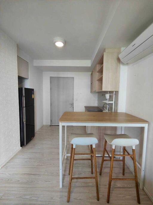 Modern kitchen with bar counter and stools