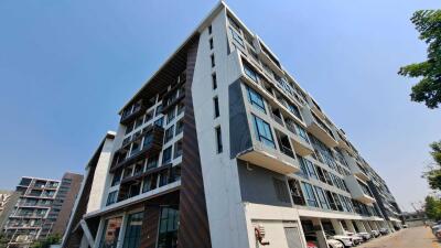 Modern apartment complex exterior with balconies