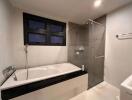 Modern bathroom with bathtub and shower