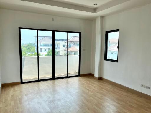 Bright living room with large windows and balcony access