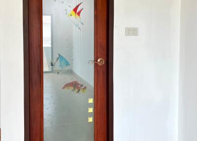 Main door with frosted glass and fish decorations