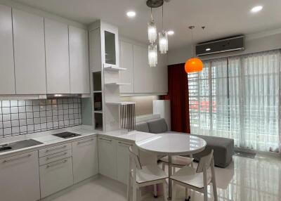 Modern kitchen with dining area and large window