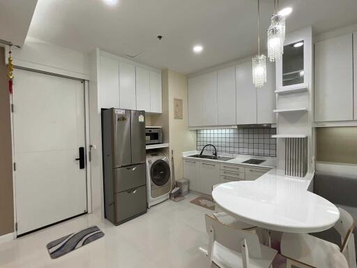 Modern kitchen with dining area and appliances