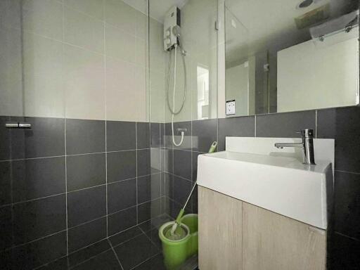 Bathroom with sink and shower area