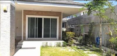 Exterior view of a modern house with a small garden