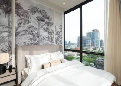 Modern bedroom with large window and city view