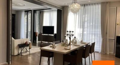 Modern dining room and living area with natural lighting