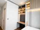 Modern bedroom with built-in storage and study area