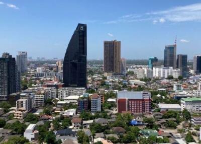 Cityscape view with tall buildings and a clear sky