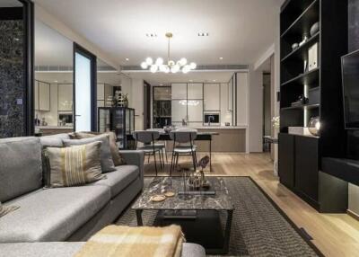 Modern living and dining area with kitchen in the background