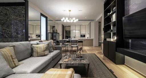 Modern living and dining area with kitchen in the background