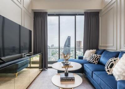 Elegantly furnished living room with a large window view