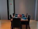 Dining area with table and chairs set up for a meal