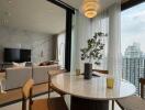 Modern living area with a dining table and city view