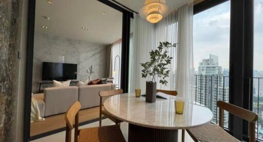 Modern living area with a dining table and city view