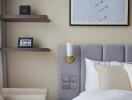 Modern bedroom with wall-mounted shelves and framed art