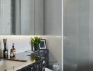 Modern bathroom with sleek fixtures and black marble counter