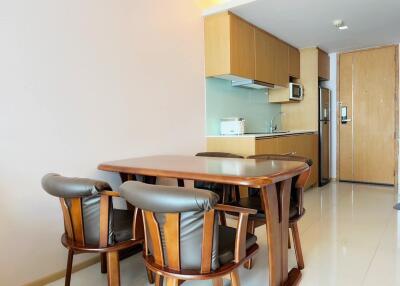 Modern kitchen and dining area with wooden furniture