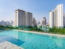 Outdoor pool with cityscape background