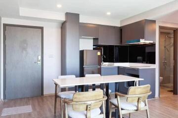 Modern kitchen and dining area with wooden furniture