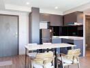 Modern kitchen and dining area with wooden furniture