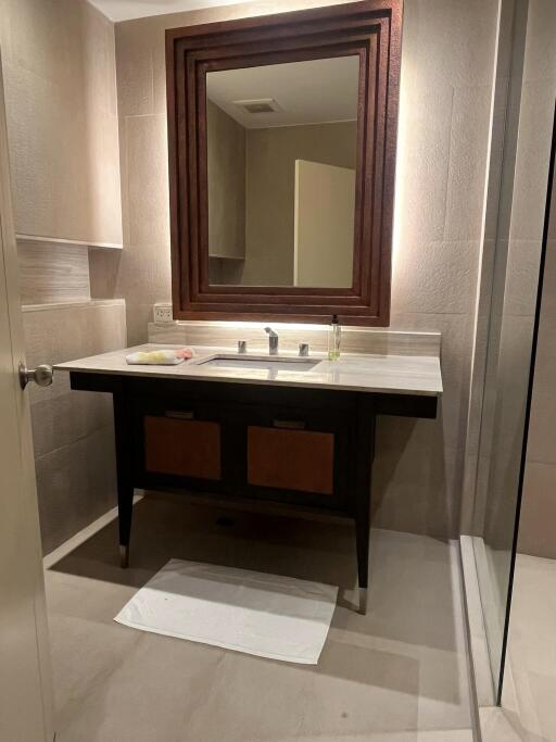 Modern bathroom with vanity and large mirror