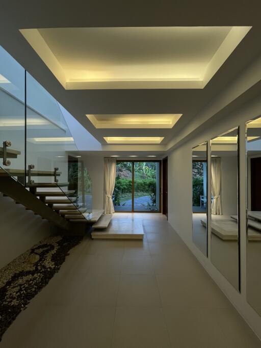 Elegant hallway with modern lighting and stairway