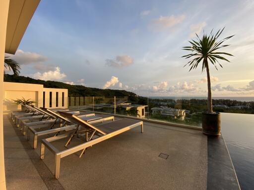 Outdoor deck with lounge chairs and a view of the landscape