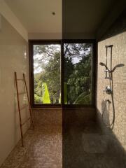 Modern bathroom with mosaic tiles, large window, and bamboo ladder