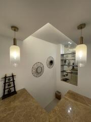 Stylish hallway with accent lighting and decorative mirrors