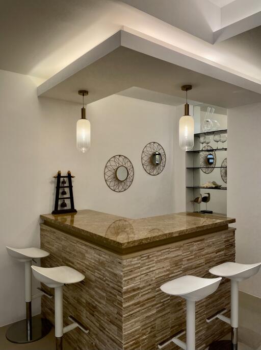 modern kitchen bar with stools and hanging lights