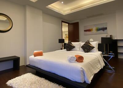 Modern bedroom with recessed lighting and stylish decor