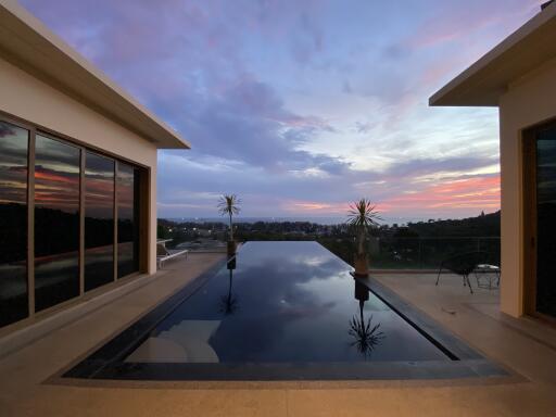 Infinity pool with a scenic sunset view
