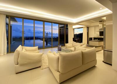 Spacious living room with large windows and modern furniture