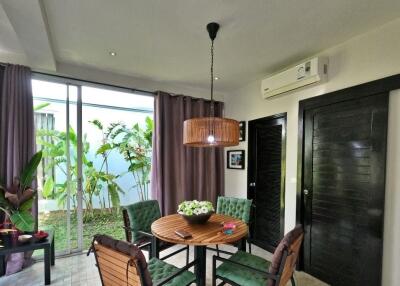 Cozy dining area with garden view and natural light