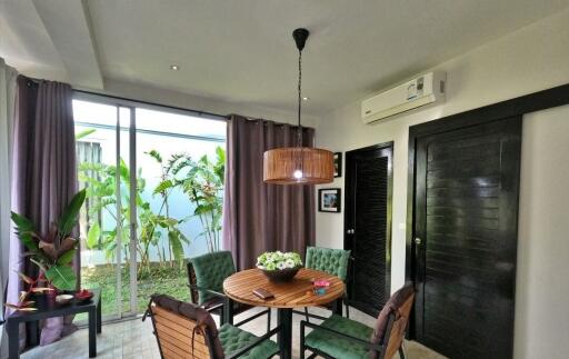 Cozy dining area with garden view and natural light