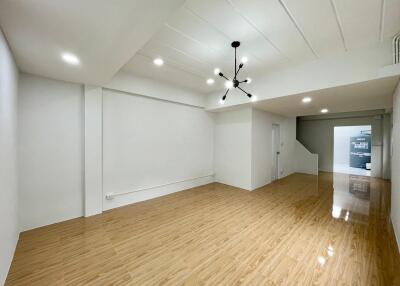 Spacious living room with modern lighting